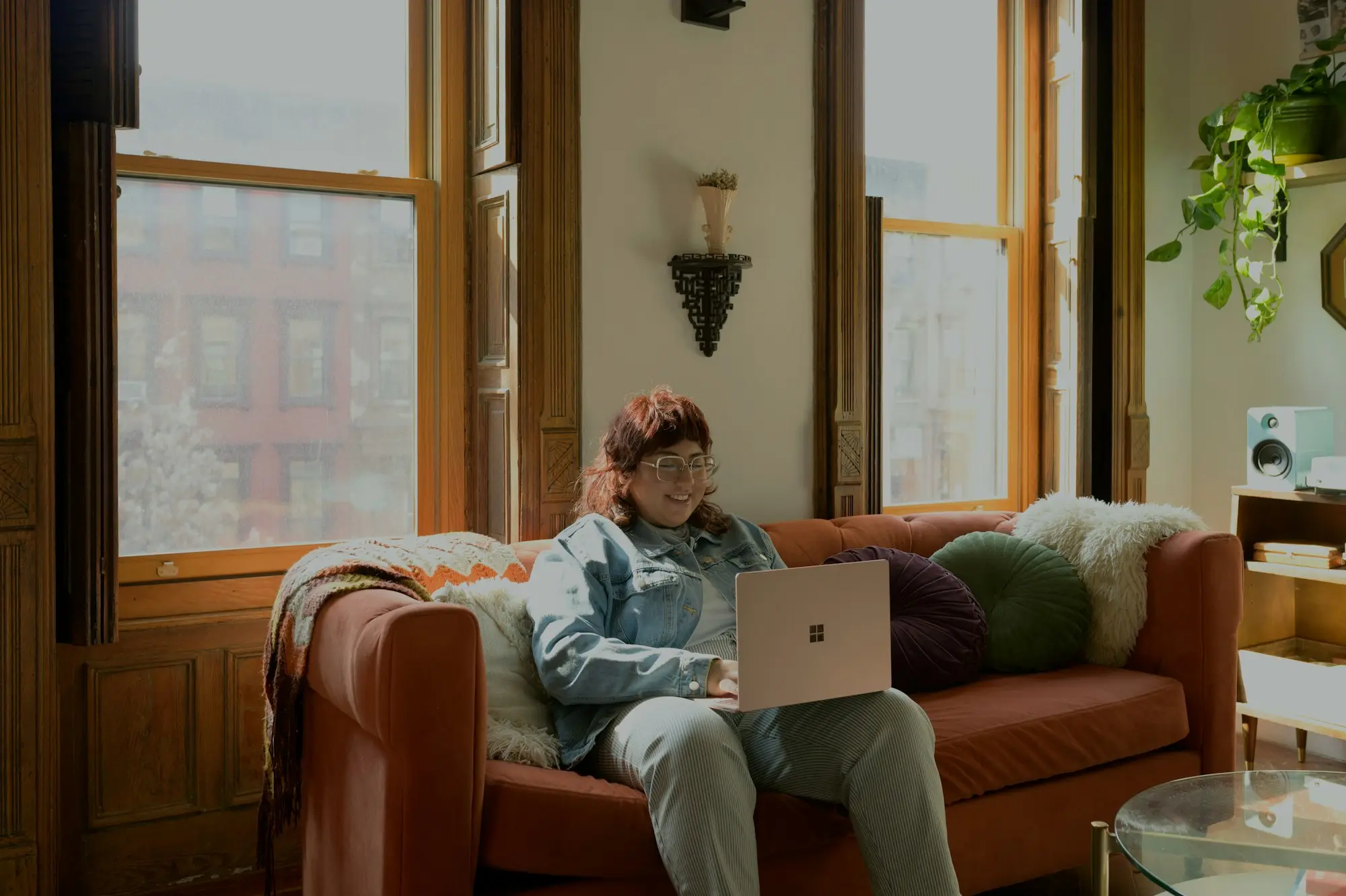Business owner reviewing bank statements on a laptop at home
