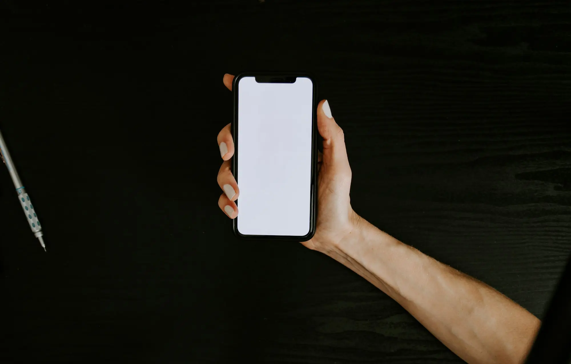 Hand holding a phone ready to call a business loan navigator